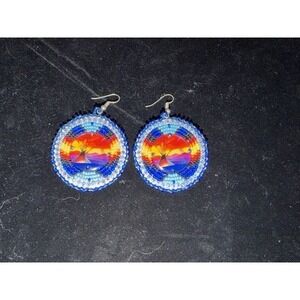 Native American-style beaded medallion earrings with mirror discs in the center